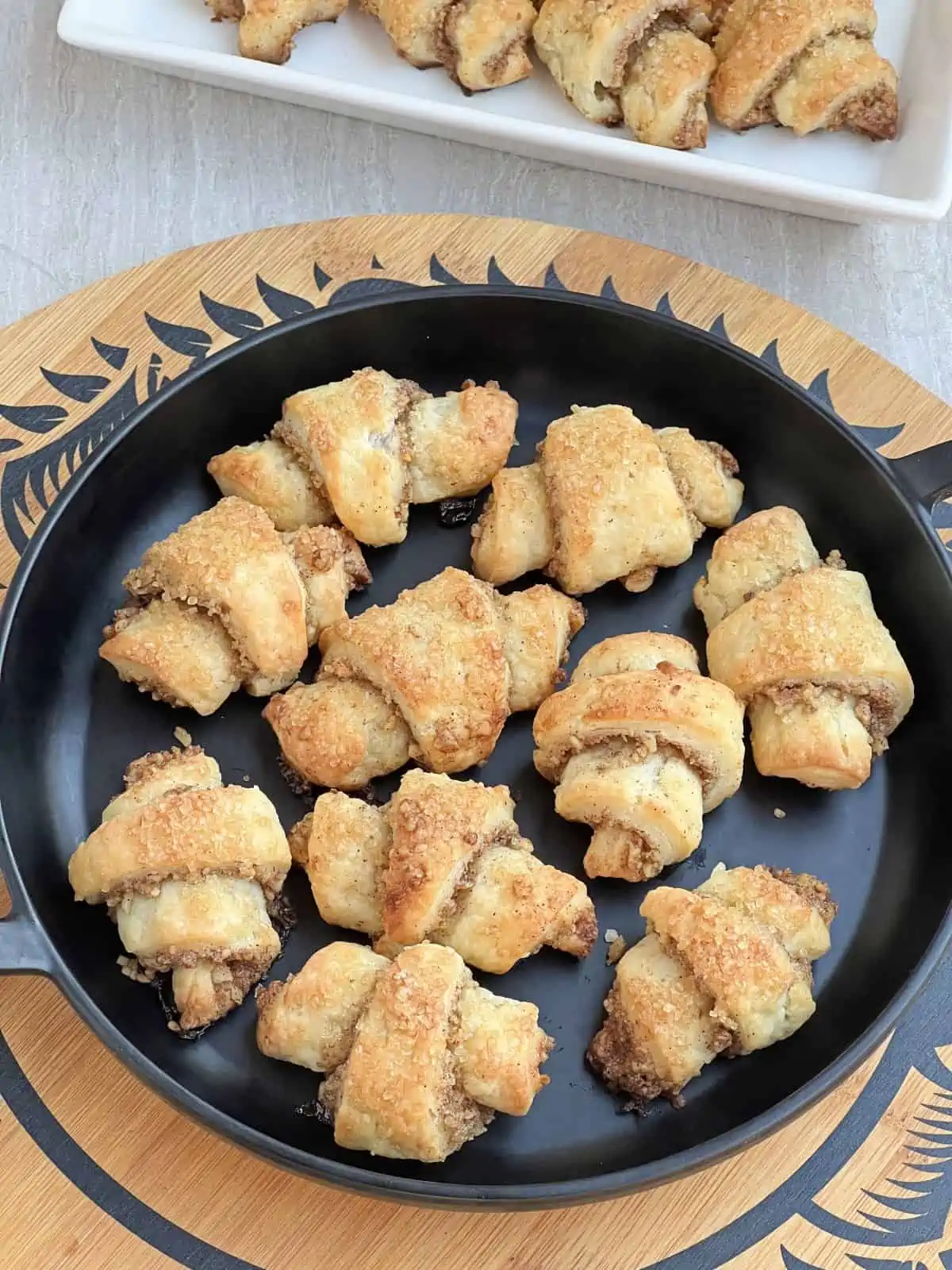 cream cheese spiral cookies in a black plate