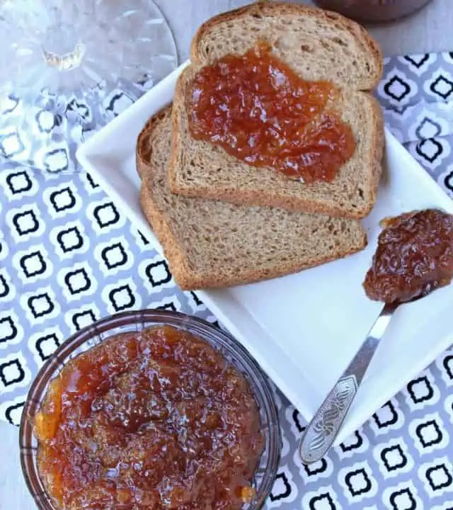 apple jam in a bowl and on bread