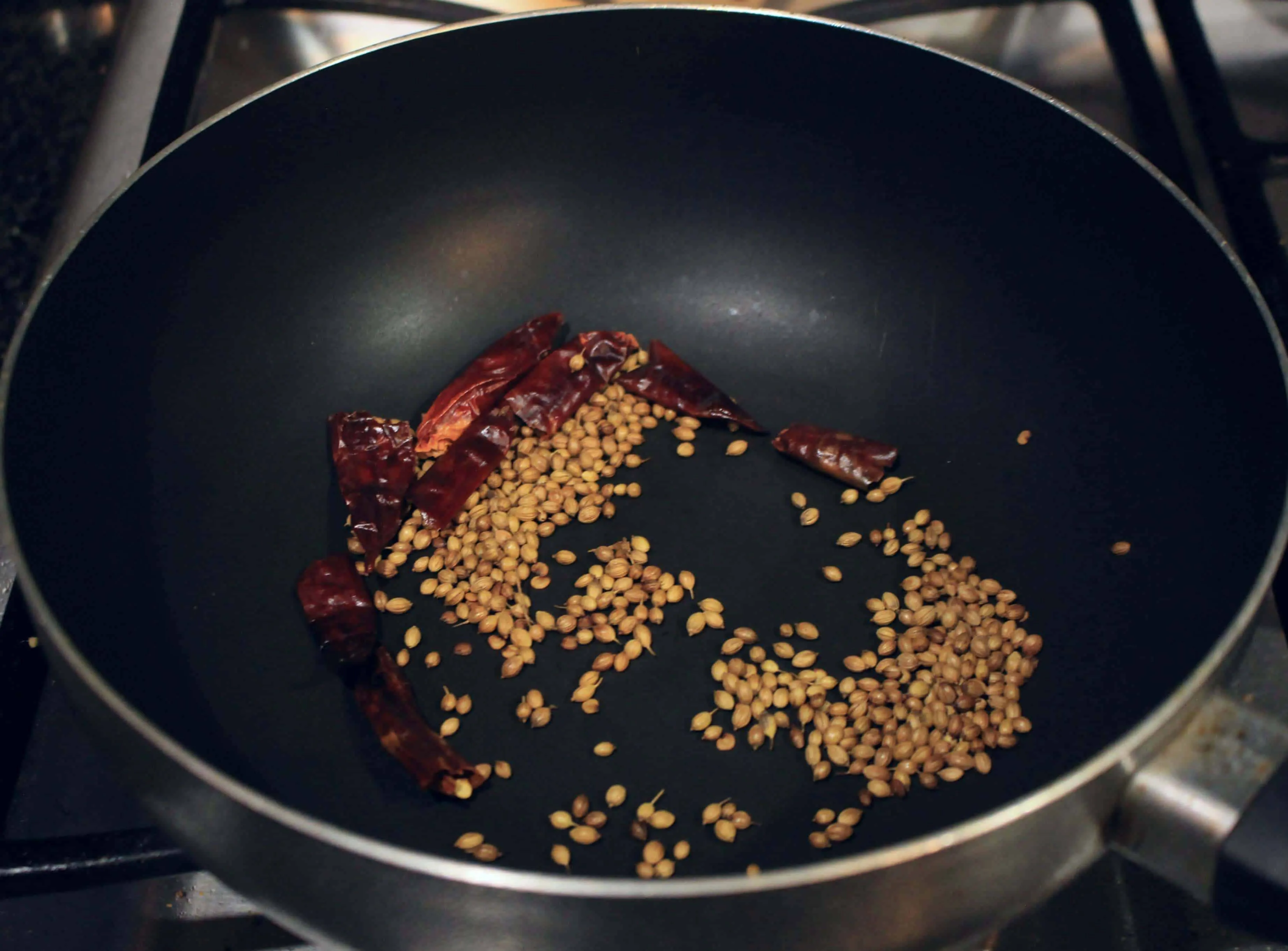 roasting coriander seeds and red chili
