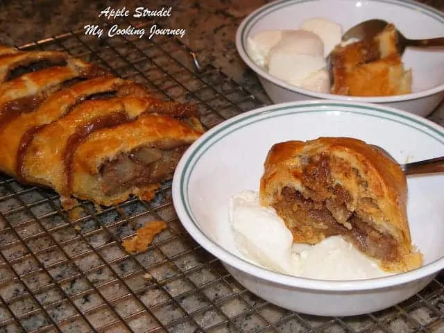 Apple Strudel in a bowl with ice cream.