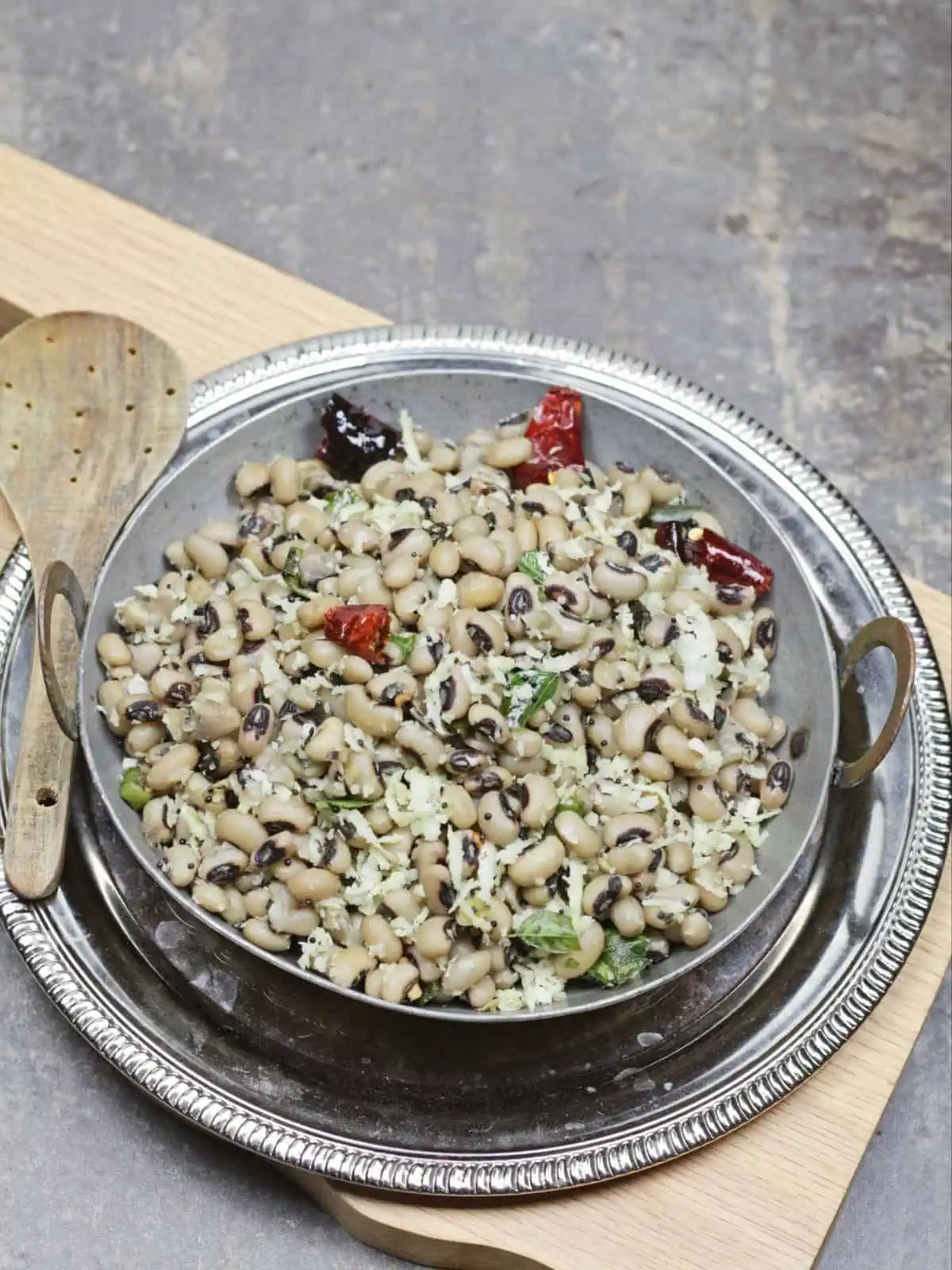 black eye beans sundal in a silver colored bowl. 