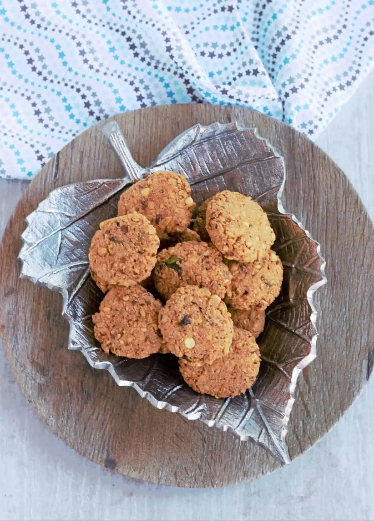 Aama vadai in a silver plate. 