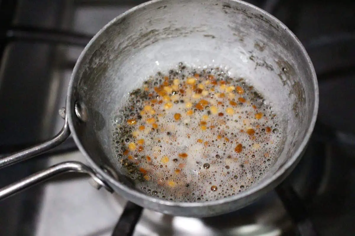 seasoning of mustard seeds, urad dal and fenugreek seeds.