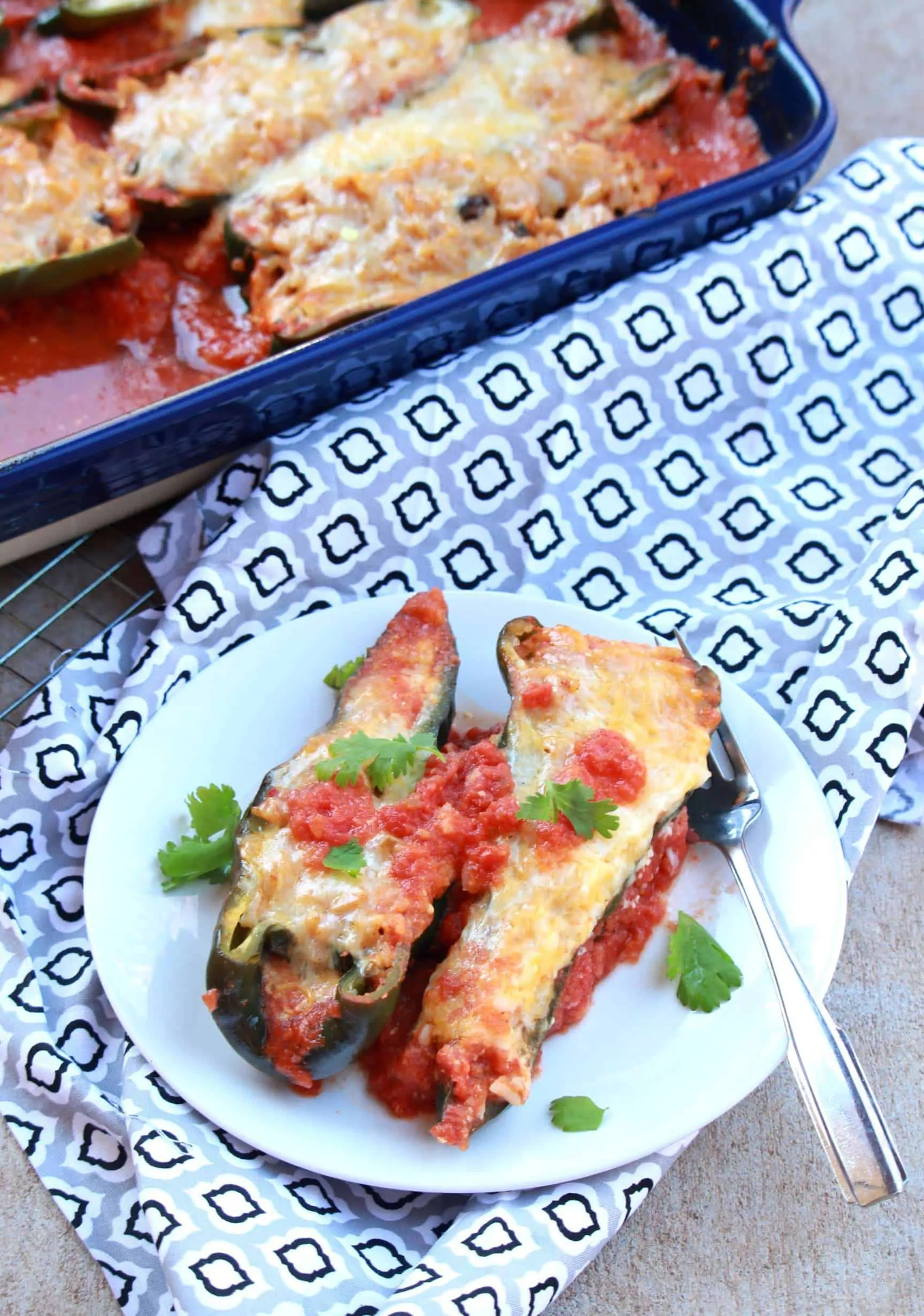 stuffed poblano pepper with cheese on a plate