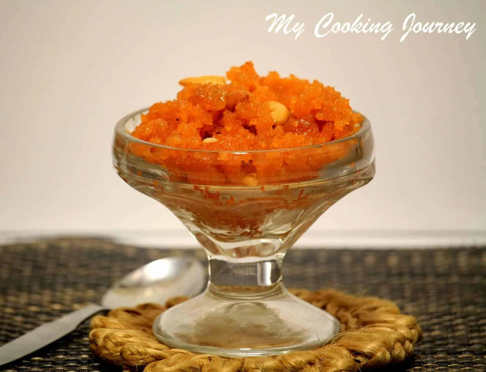 Aval Kesari in a glass bowl.