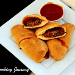 Vegetable Calzone in a plate with Sauce