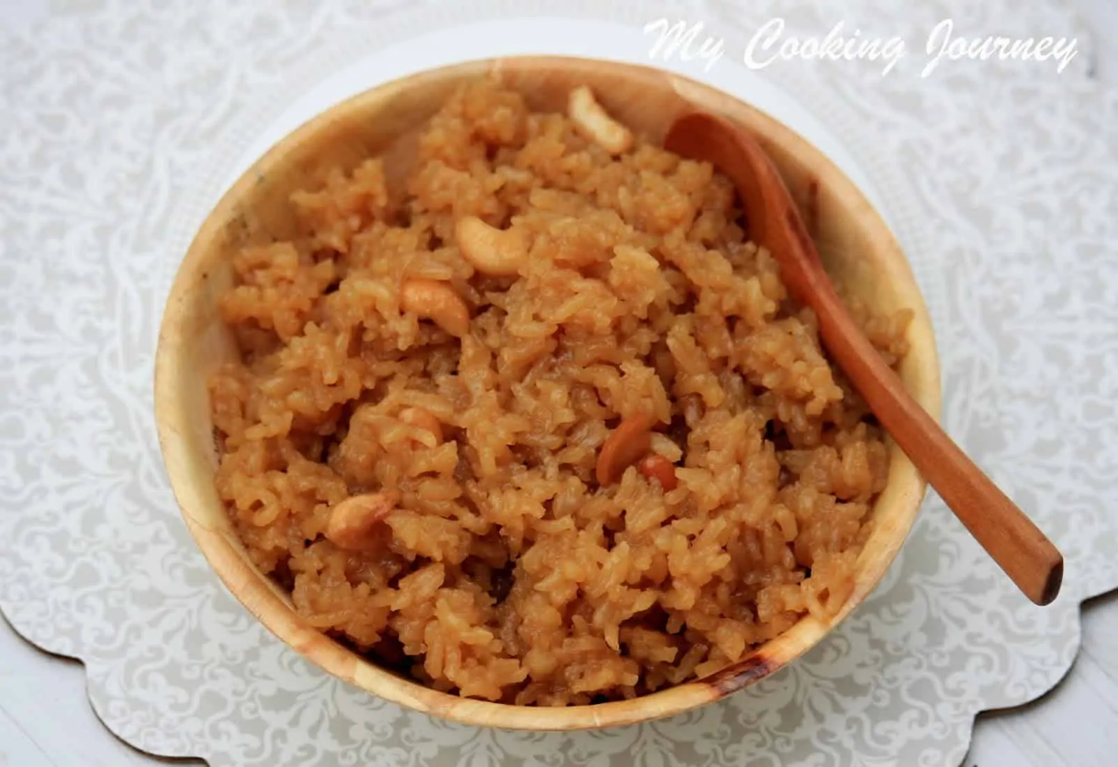 Aravanai prasadam in a bowl with spoon