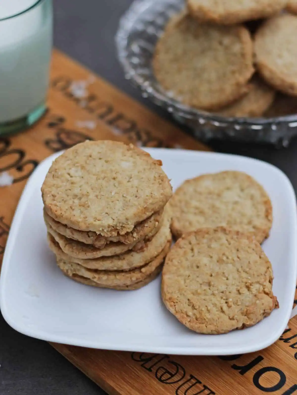 stacked cookies in a white plate.