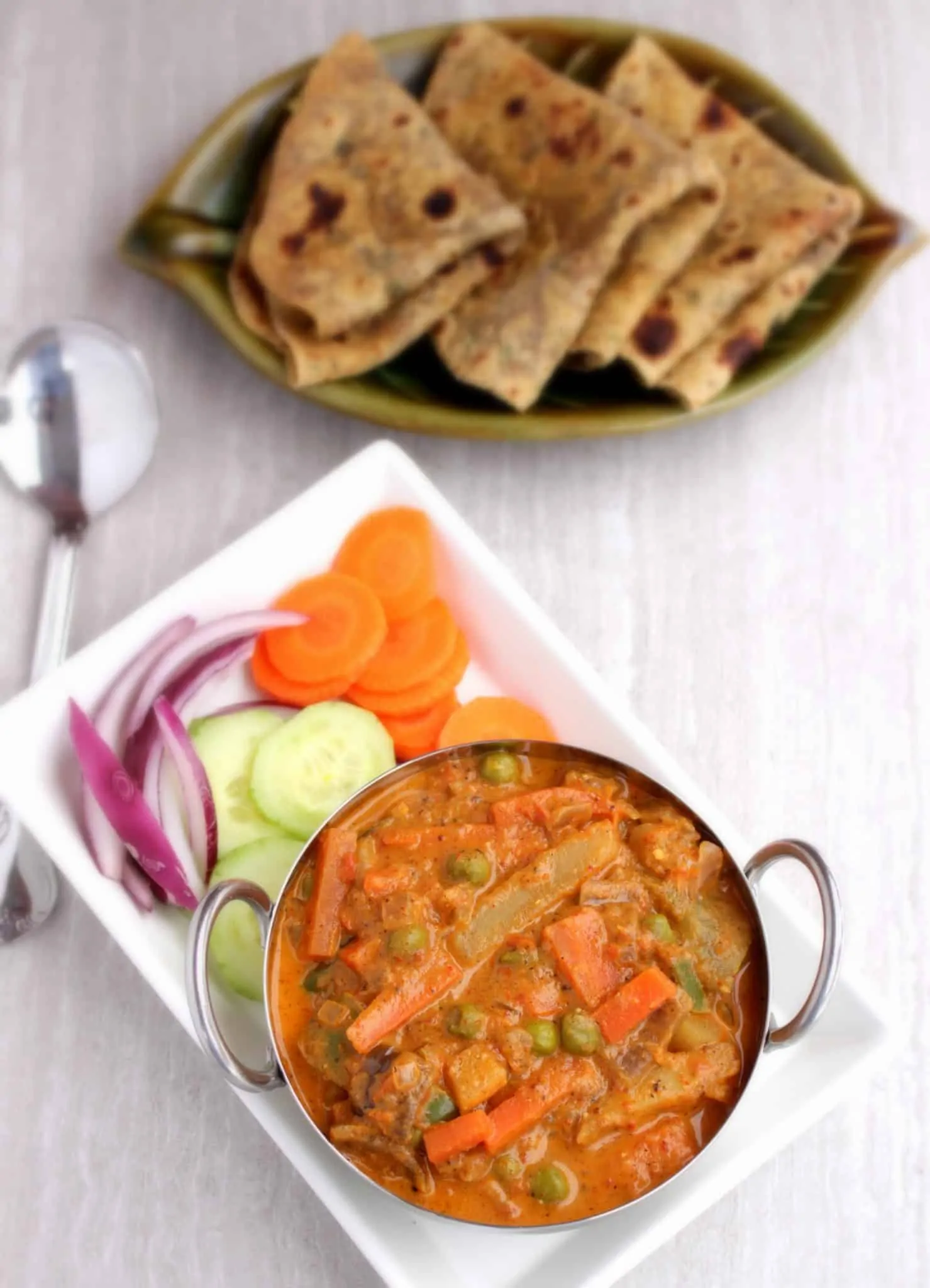 Kadai Vegetable Gravy - Final product with raw onions, cucumbers, carrots and roti