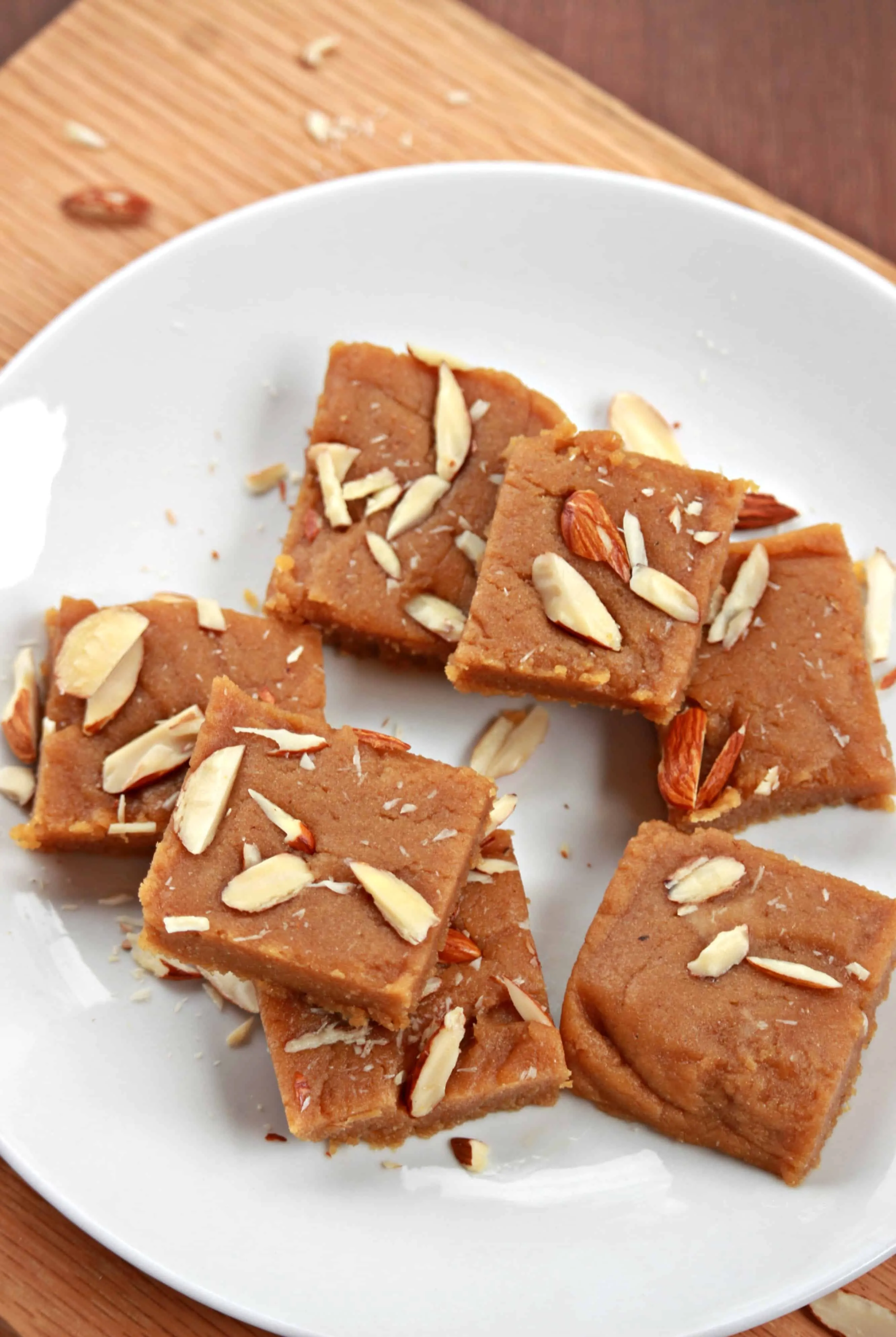 Gur papdi arranged on a white plate