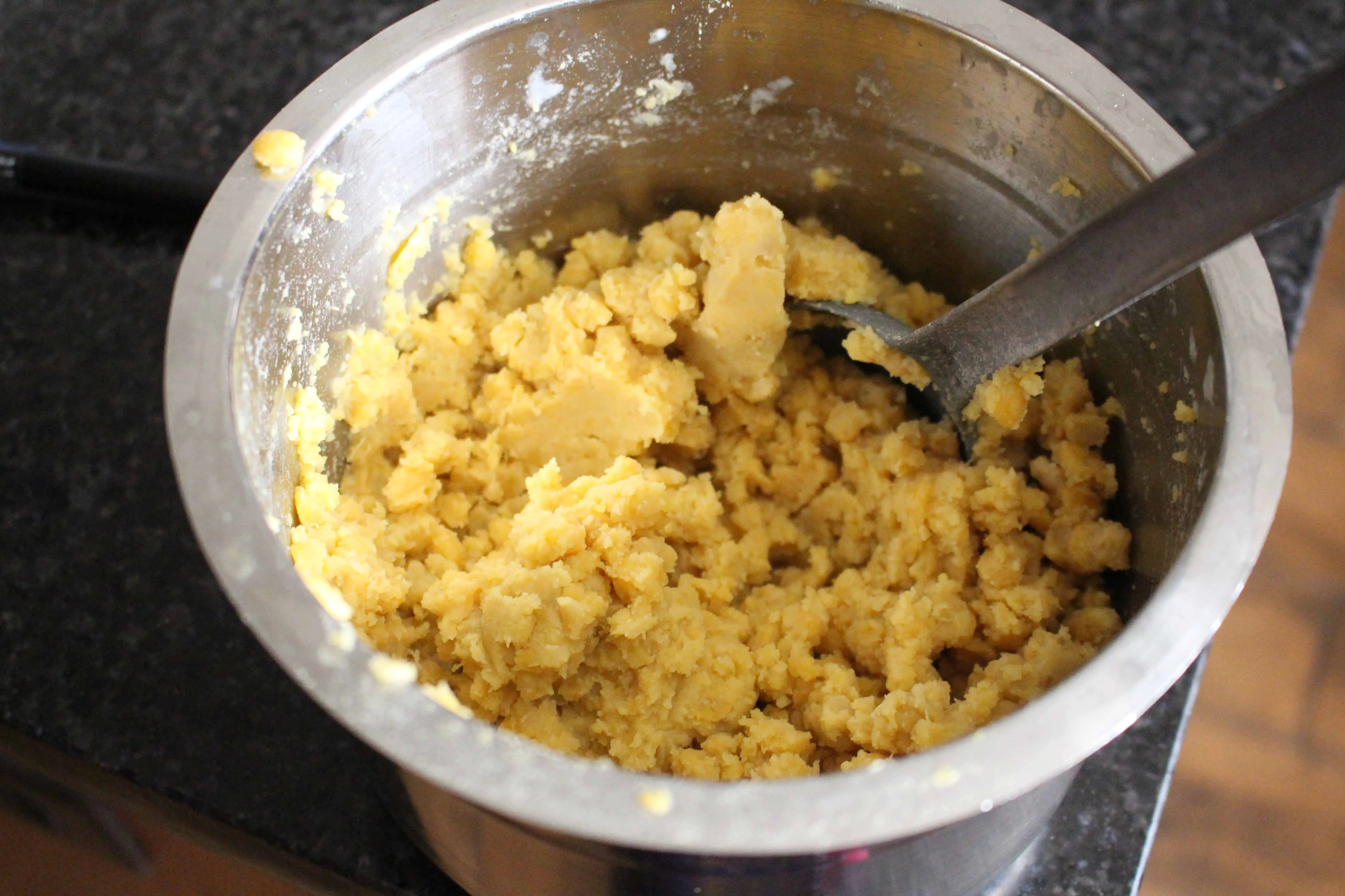 Mashing soaked lentils.