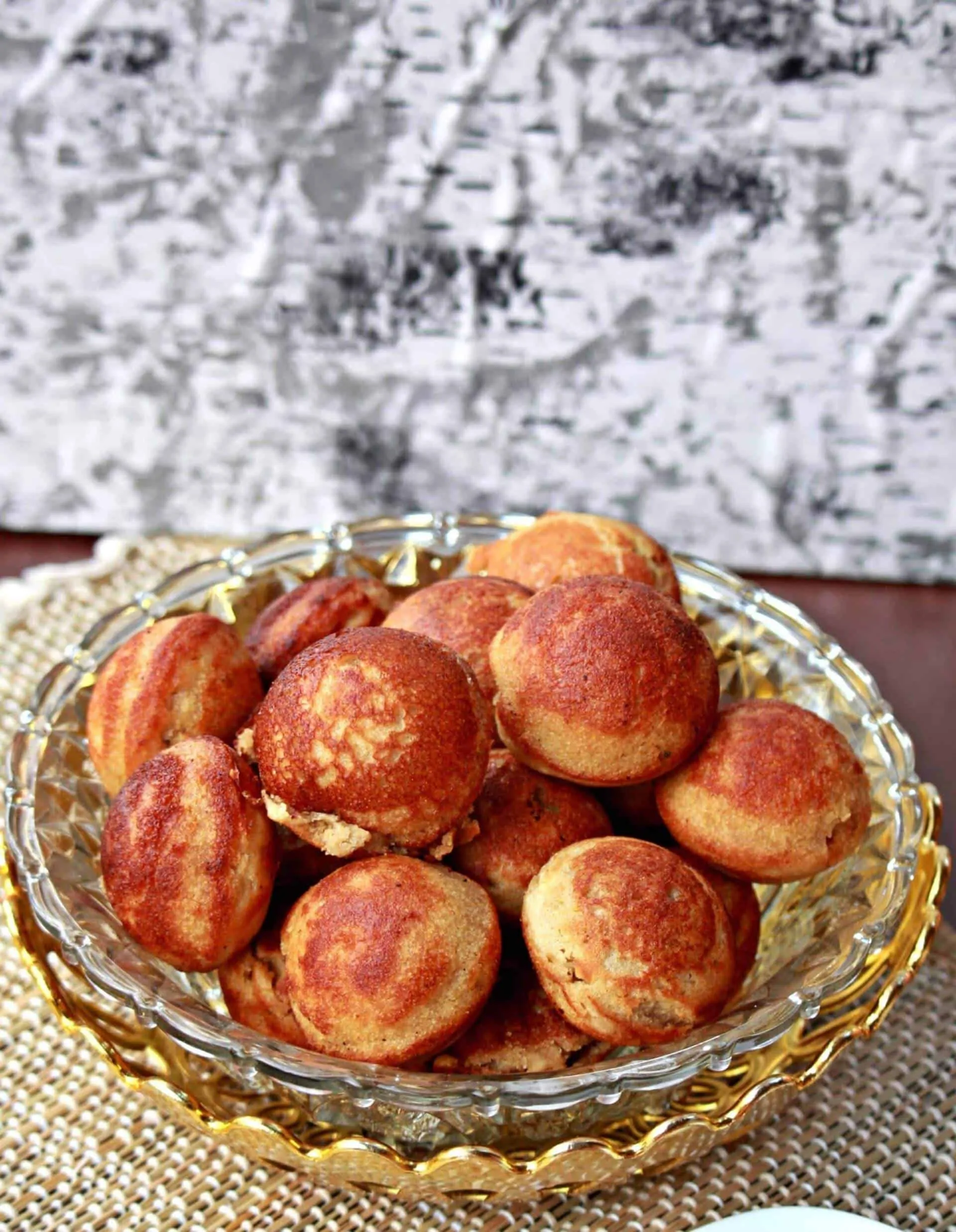 Thinai Sweet Paniyaram in a glass bowl.