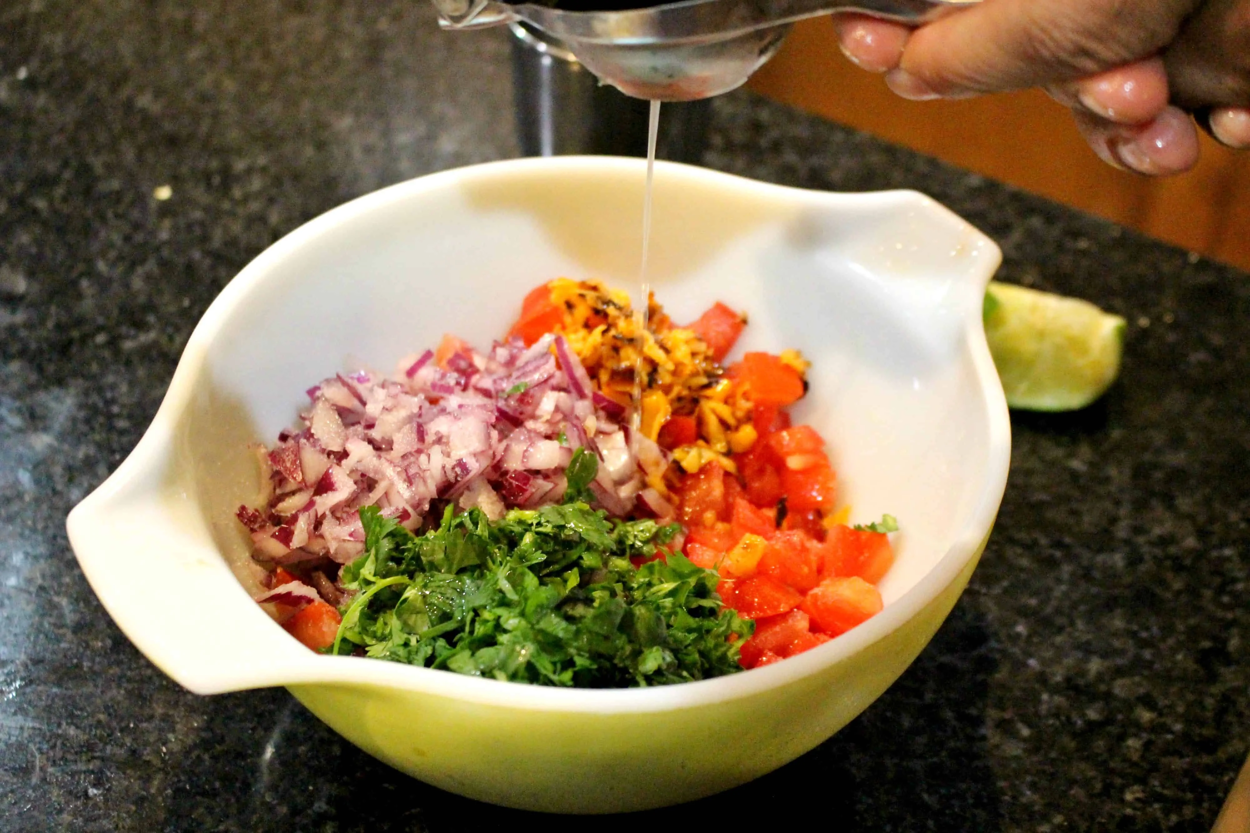 Adding lemon juice on Salsa.