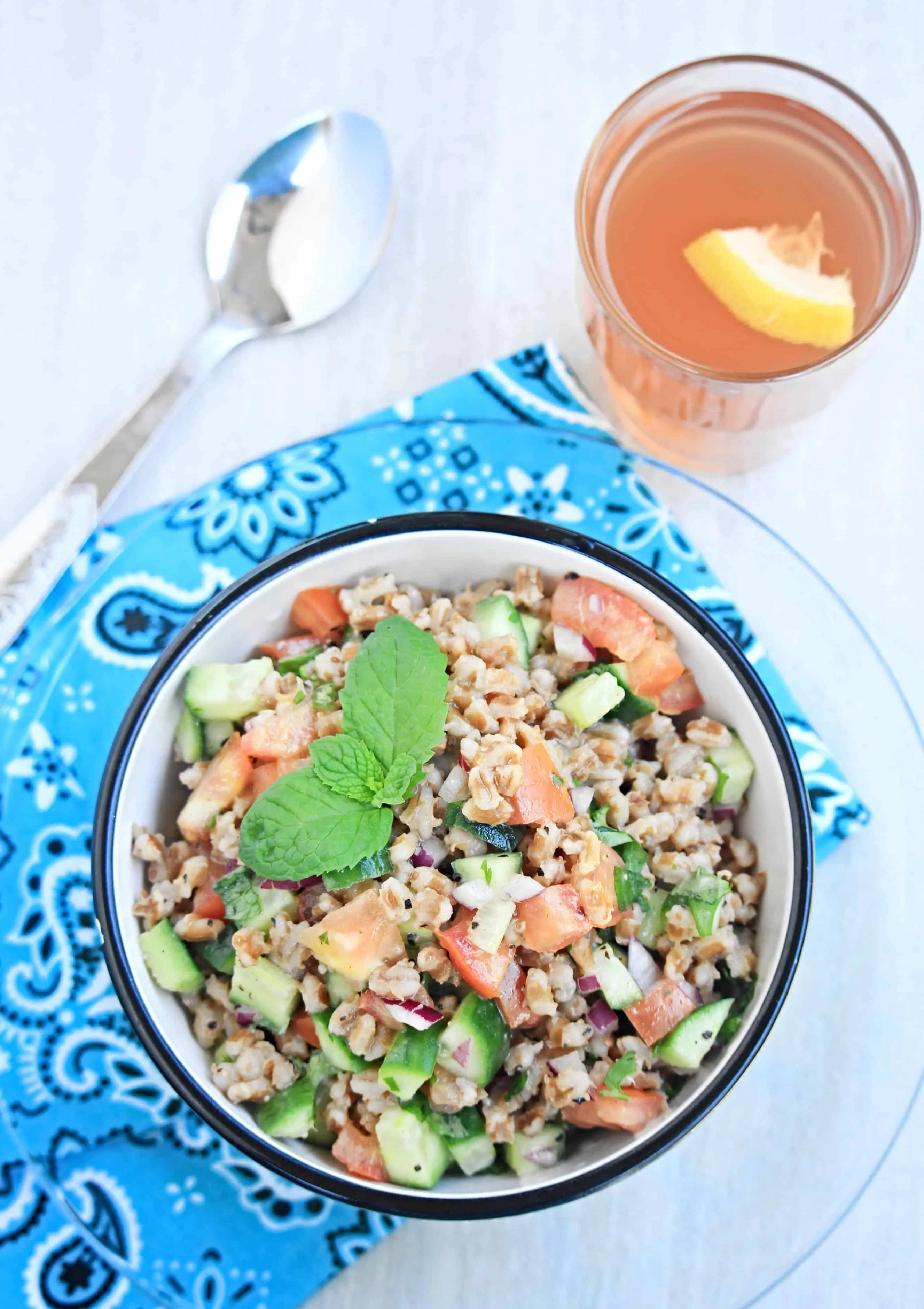 Barley Cucumber Salad garnished with mint and served with barley tea.