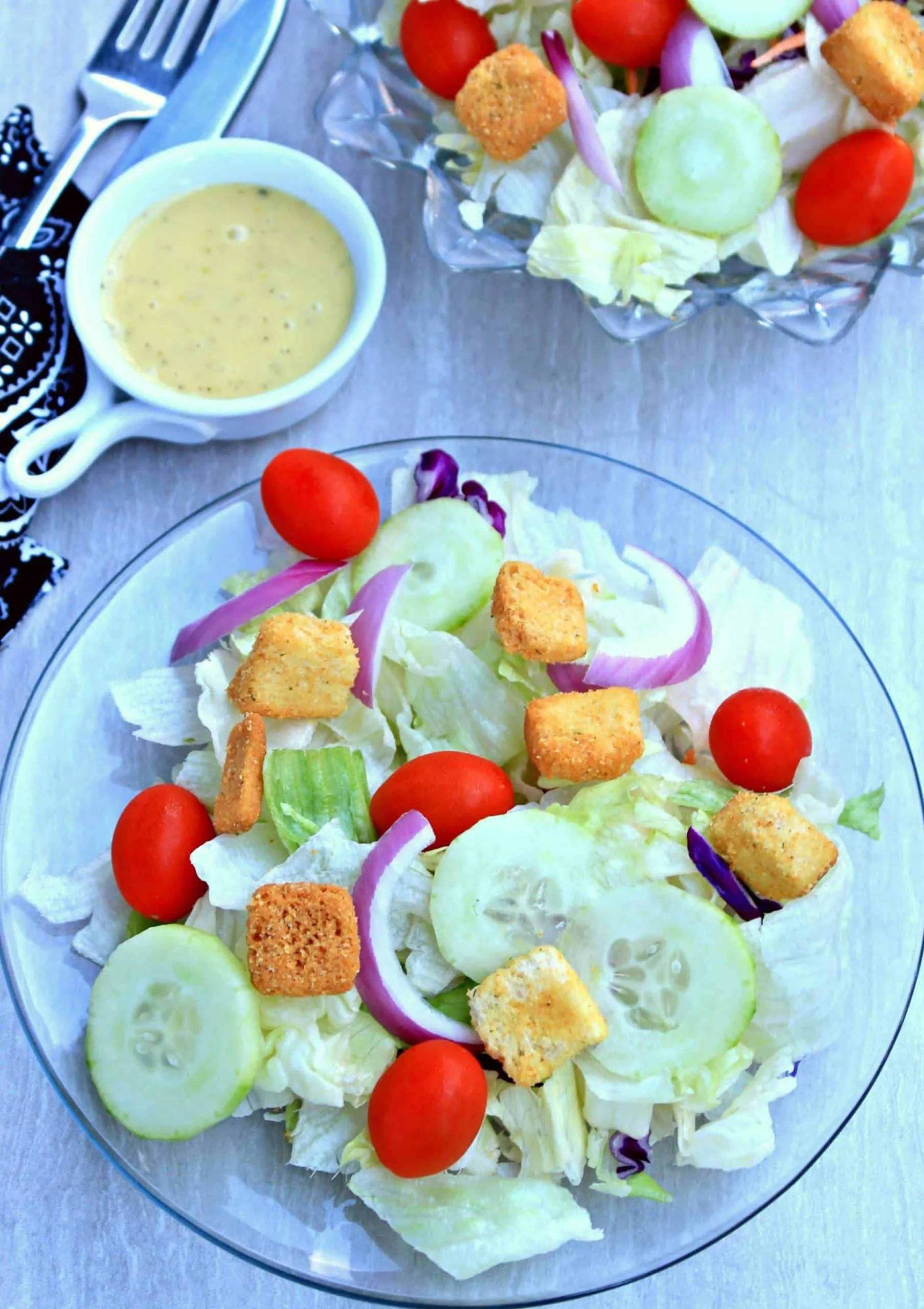 Garden Salad in a bowl with salad dressing.