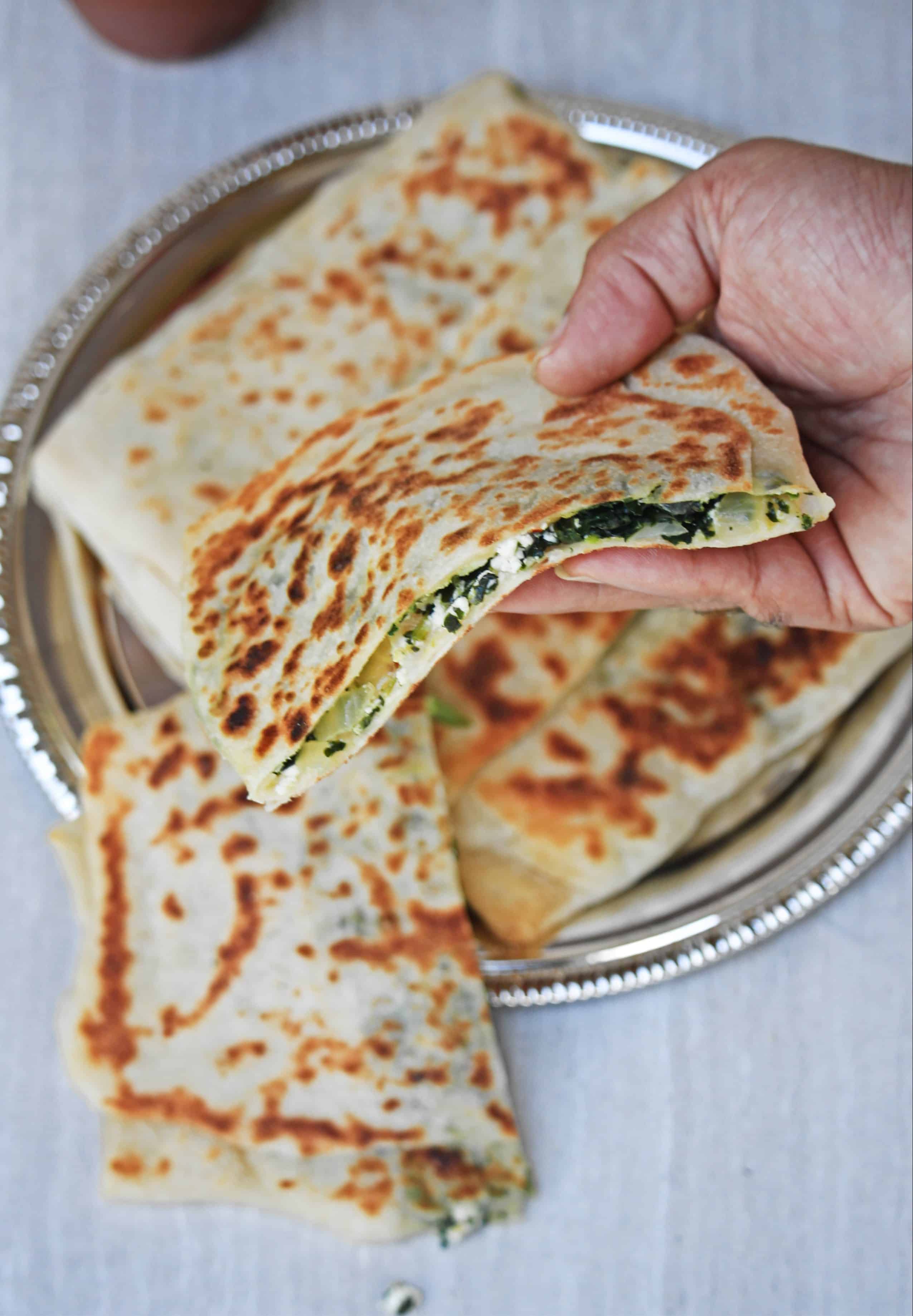 gozleme flatbread slice held in hand