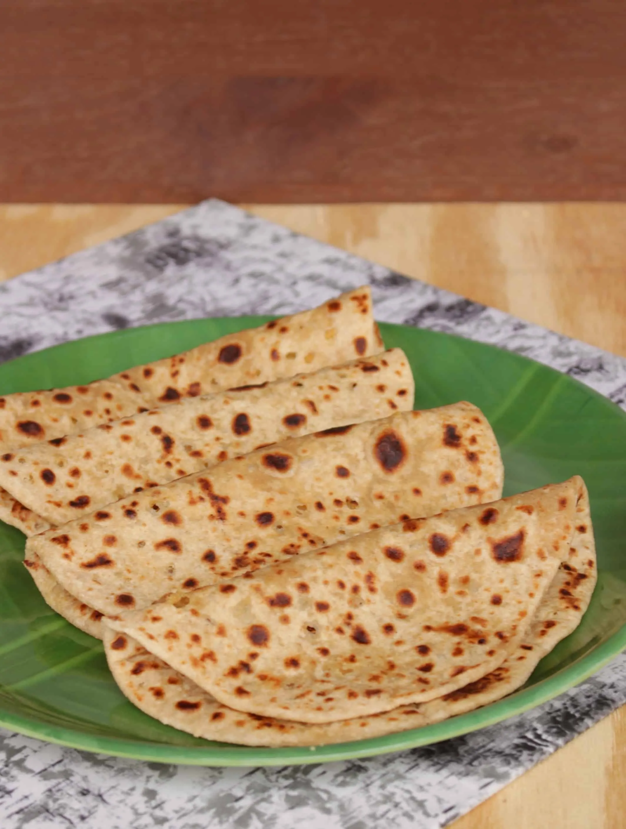 maharashtrian puran poli on green plate