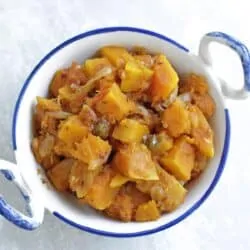 Butternut squash curry in a white bowl