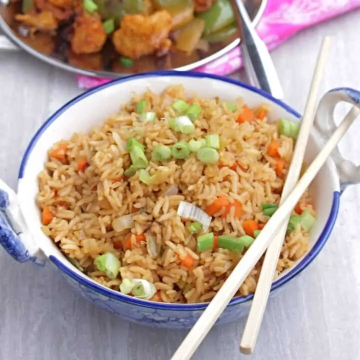 fried rice with chop stick on top