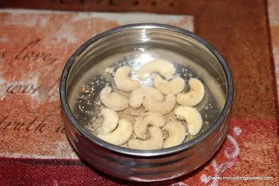 Soaked cashew and [poppy seeds in a bowl. 