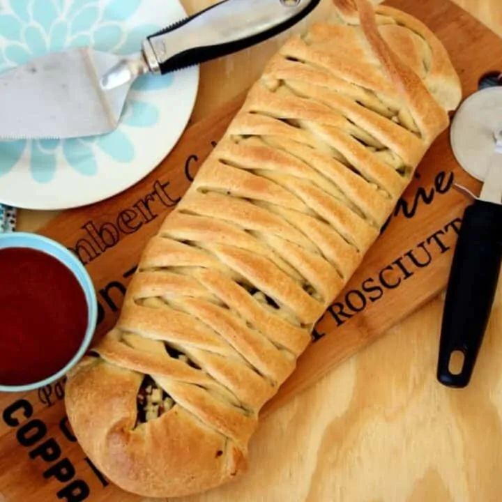 braided bread on a cutting board