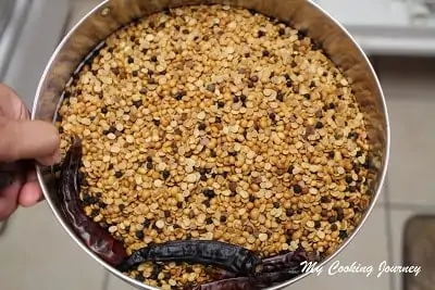 Adding the roasted masala in a bowl