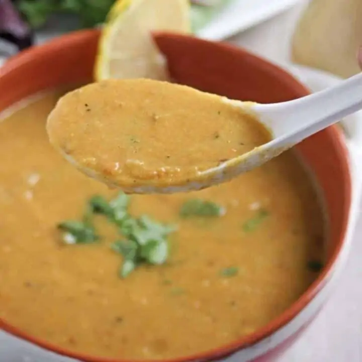 lentil soup in a bowl and spoon