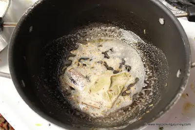 frying spices in a pan