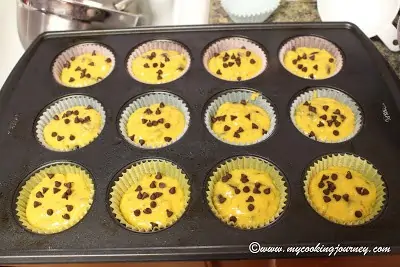 Filling the prepare muffin tins