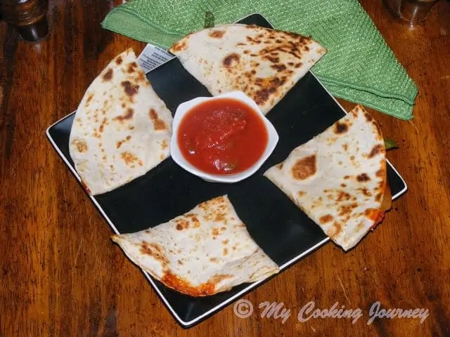 Pizzadilla – Fusion Of Pizza And Quesadilla served in a tray