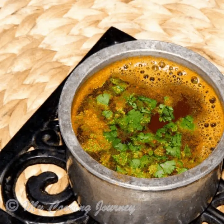 Thakkali Juice Rasam in a pot