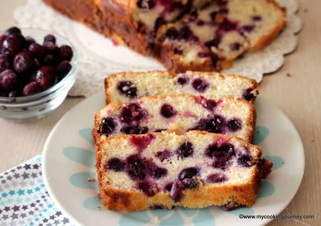 Lemon Blueberry Cake sliced in a dish