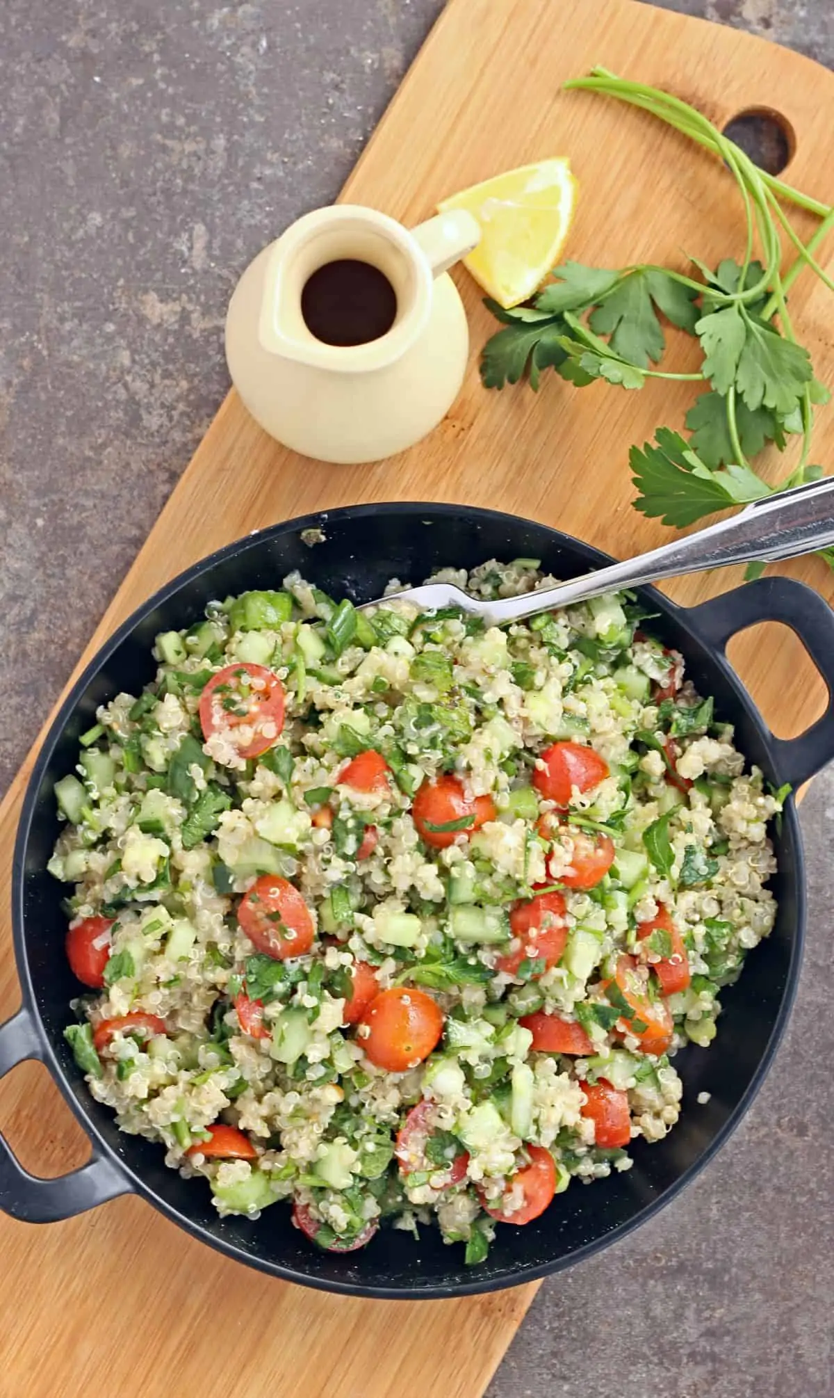 Quinoa tabbouleh in a black plate