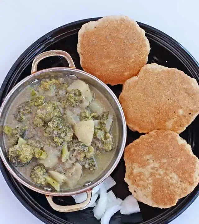 Broccoli potato kurma in a skillet