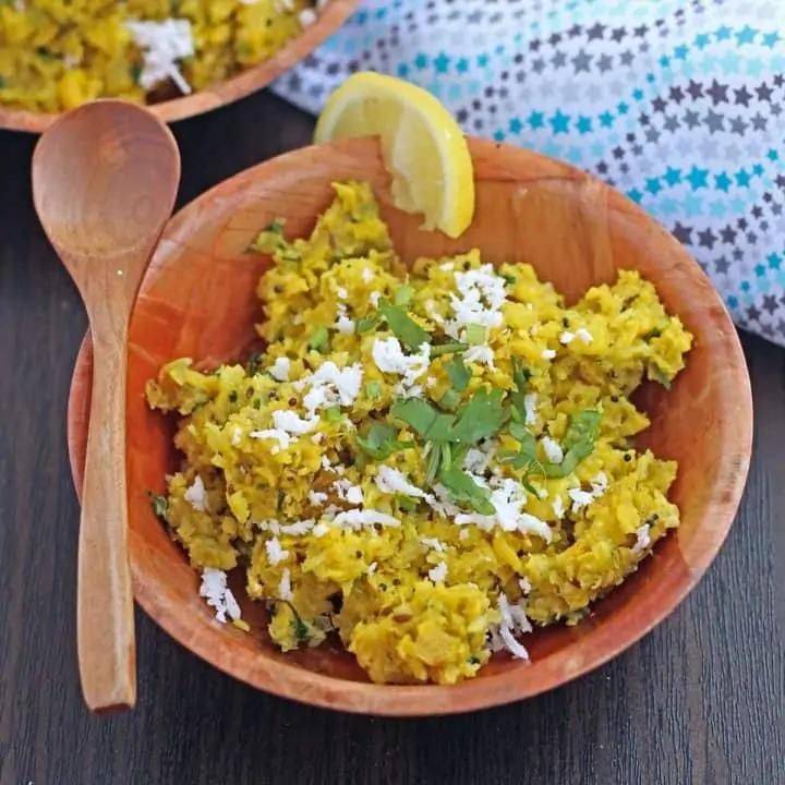 Indore style bhutte ka kees in a bowl with spoon