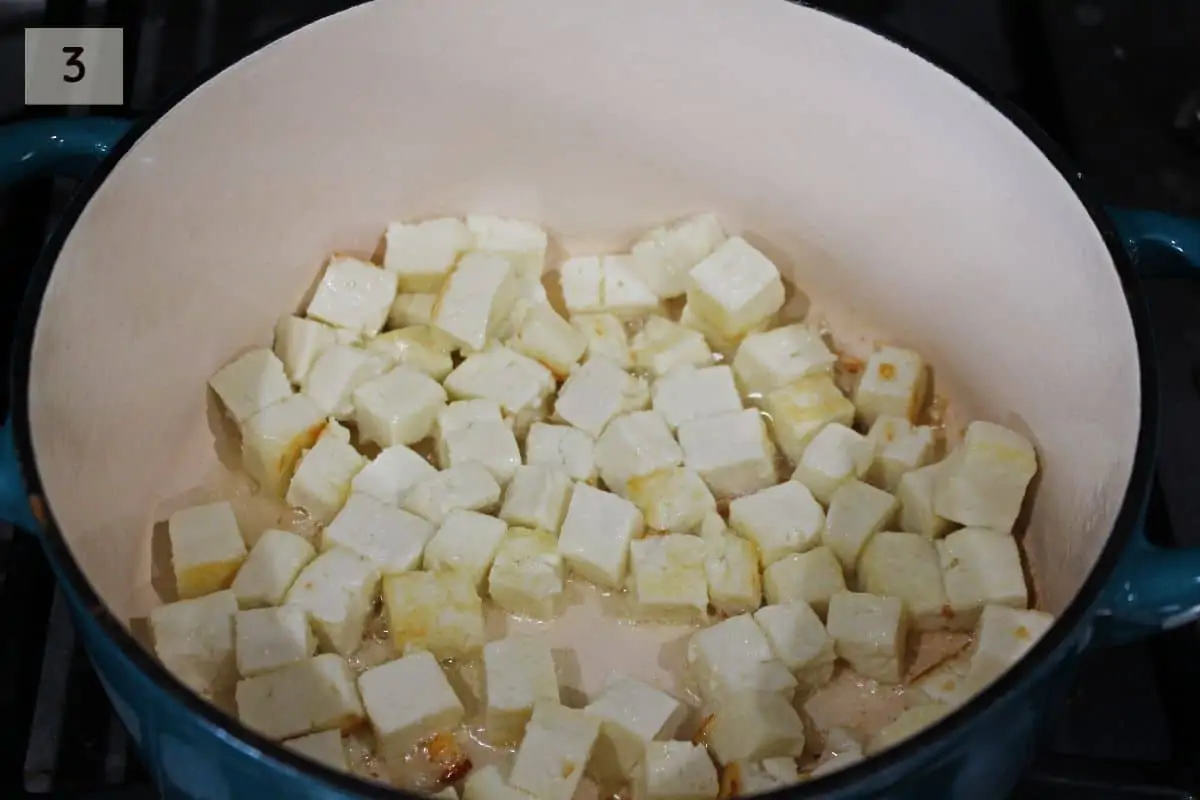 pan frying paneer cubes in dutch oven