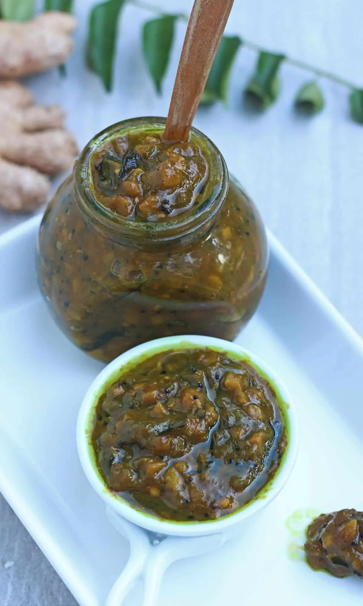 Puli inji in a glass jar and in a small white bowl