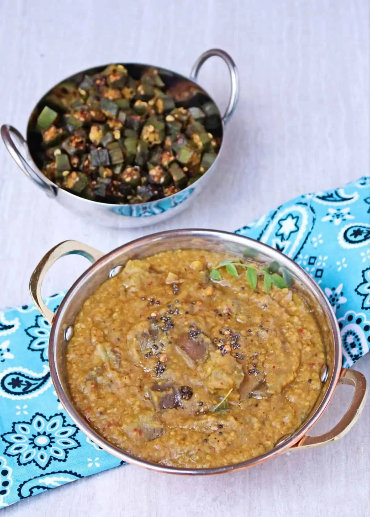 Kathirikkai Rasavangi with Okra Curry in the background.