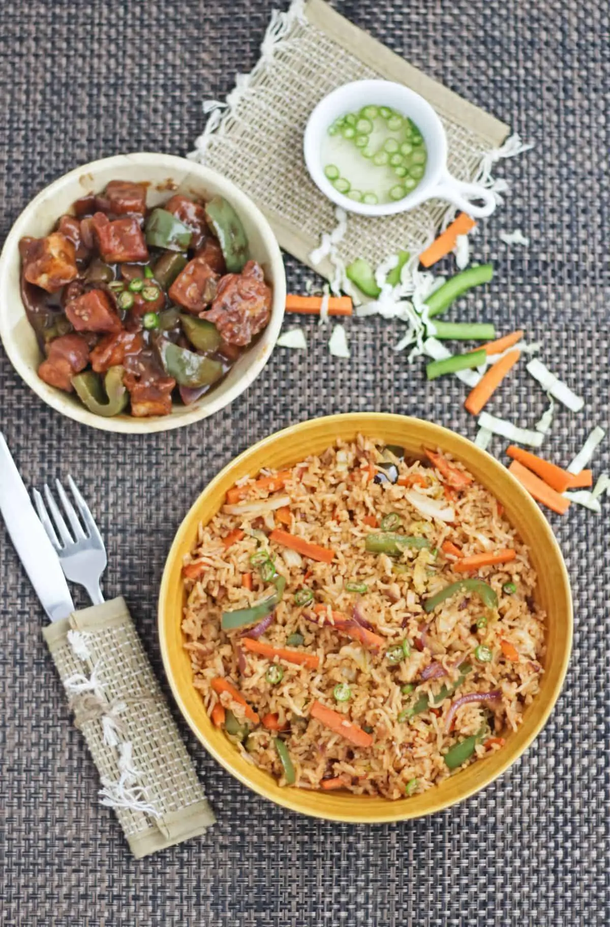 fried rice with vegetables and tofu stir fry and chili sauce on side