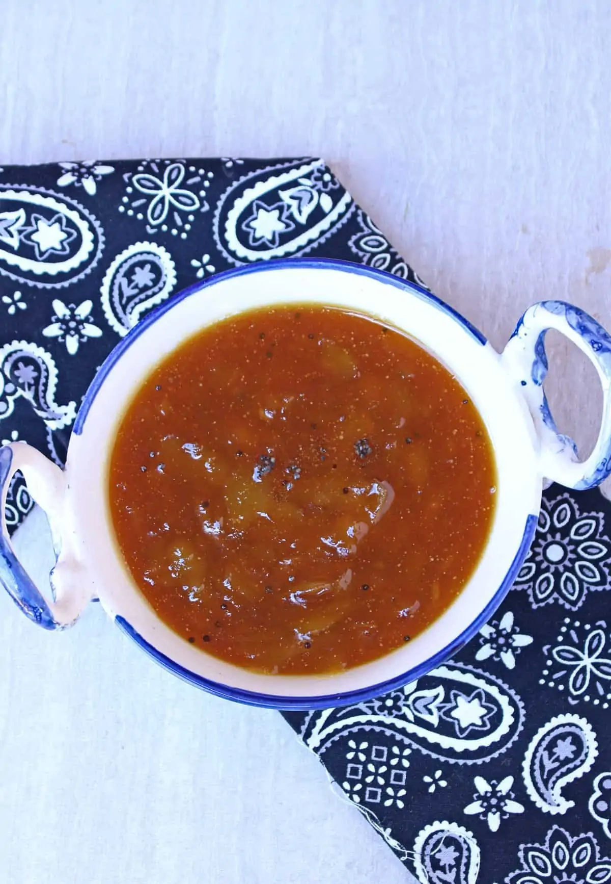 mango pachadi in a white and blue bowl