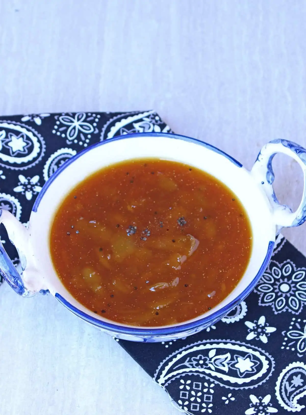 Mango pachadi in a blue and white bowl