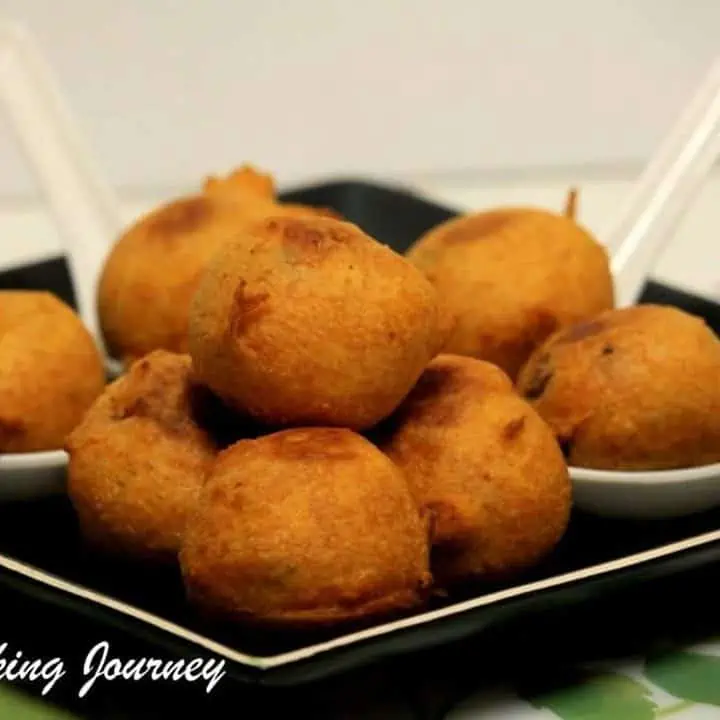 Aloo Bonda in a black plate - Featured Image