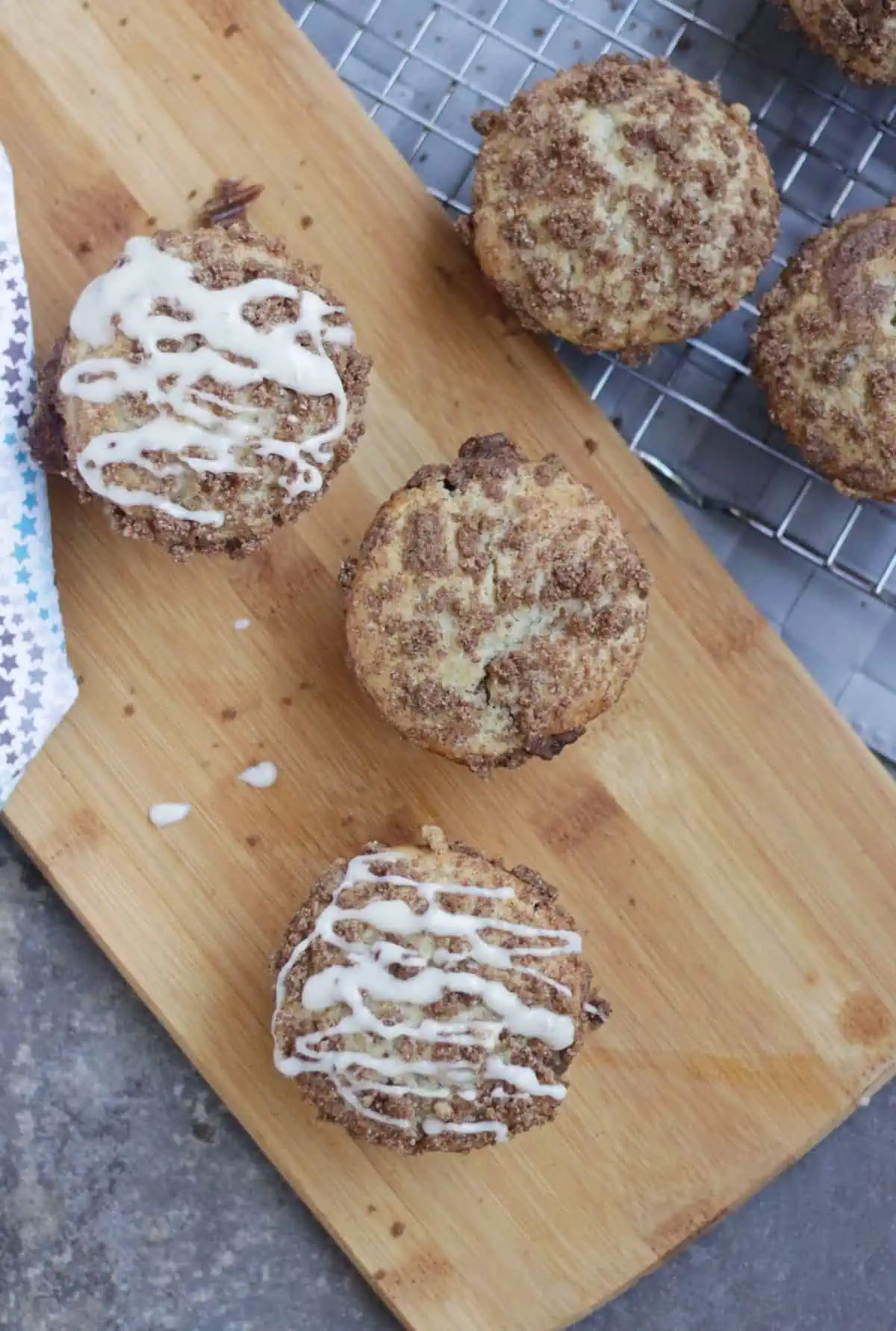 Muffins with cinnamon sugar topping and cream cheese glaze.