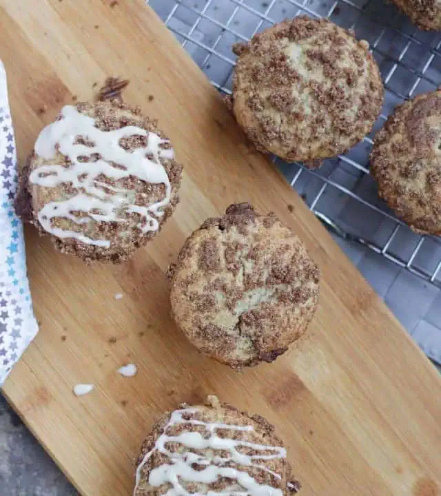 Muffins with cinnamon sugar topping and cream cheese glaze.