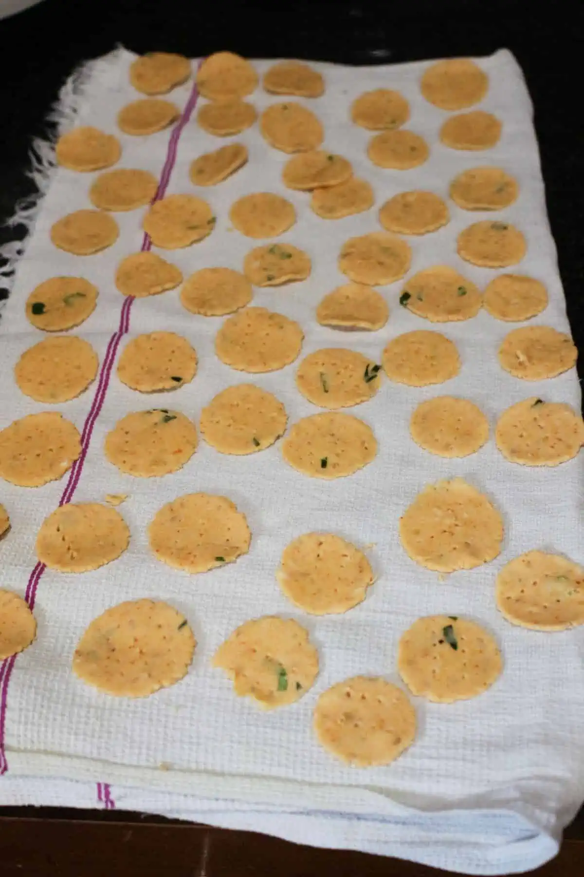 shaped thattai drying on a cotton cloth.