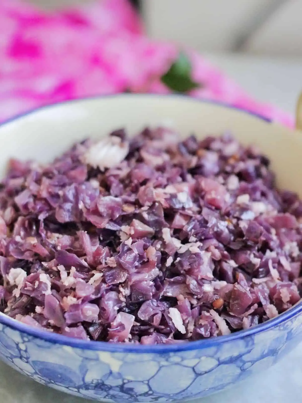 Side view of cabbage poriyal in a bowl.