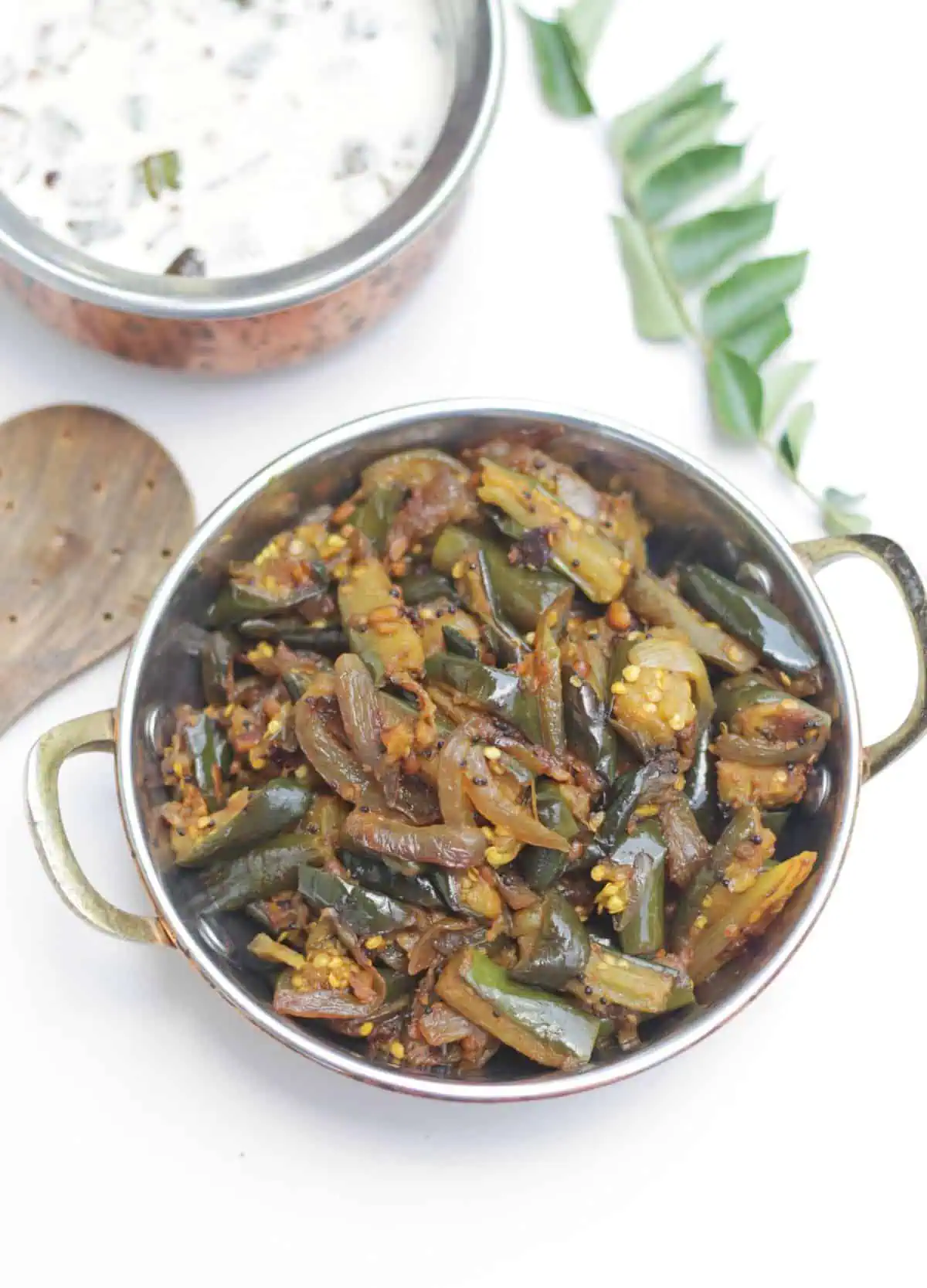 Eggplant and onion stir fry in a bowl.