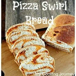 Pizza Swirl Bread on a wooden block - Feature Image