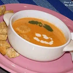 Cream of tomato soup in a white bowl - Feature Image