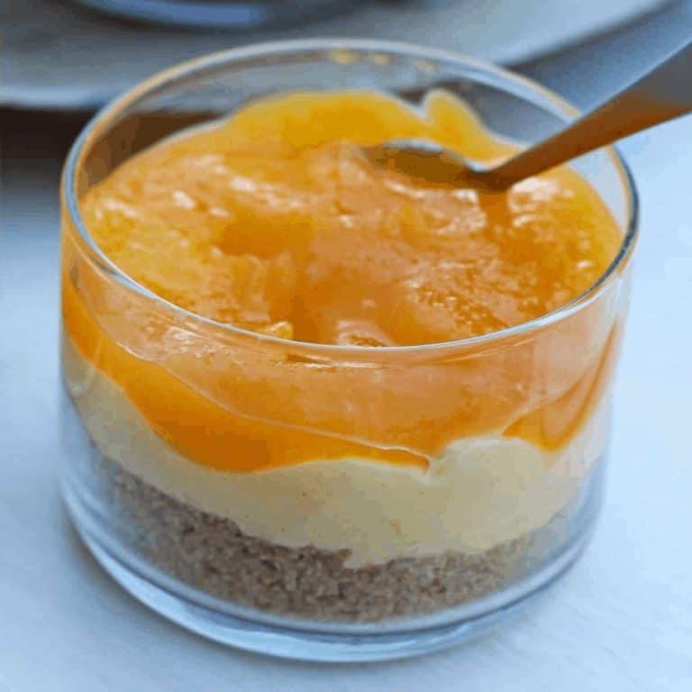 No Bake Mango Cheesecake in a glass bowl - Feature Image